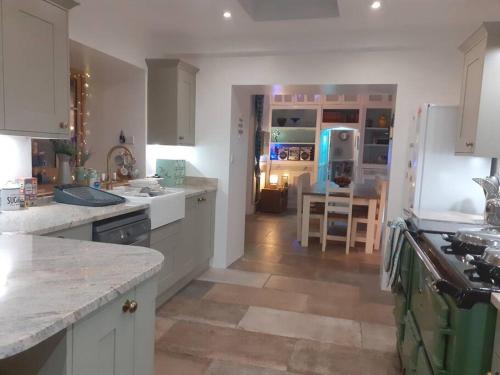 Llanelli House | Big fireplace aga hot tub wet room barn garage