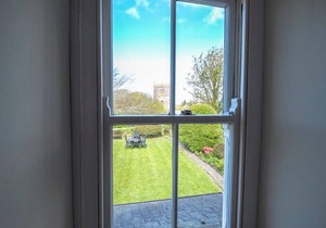 Spacious cottage in the heart of St Davids overlooking cathedral with parking .