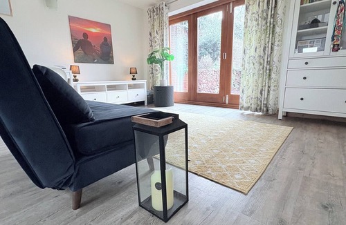Lea Marston Apartment | A beautifully styled duplex apartment with private riverside decking& a fire pit