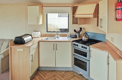 Narberth House | Comfortable and spacious 12ft-wide caravan with one double and two twin.