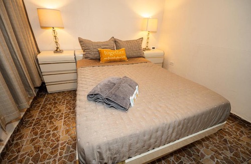 Bucana Apartment | Compact Haven with Private Entrance and FREE Parking and Laundry