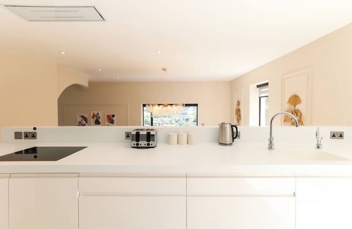 Matlock Bath House | Perched above Matlock Bath, 37 Steps is a stylish upside-down home designed to make the most of its incredible views across the valley. With a sociable open-plan living space, four ensuite bedrooms, and a showstopping terrace with hot tub.