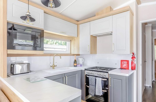 Axminster Apartment | Spacious and luxurious 12ft-wide caravan with one double and two twin bedrooms.