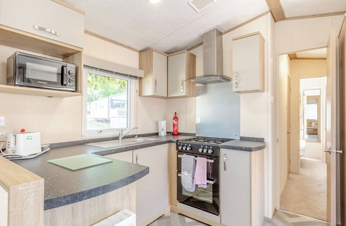 Axminster Apartment | Spacious and luxurious 12ft-wide caravan with one double and one twin bedroom.