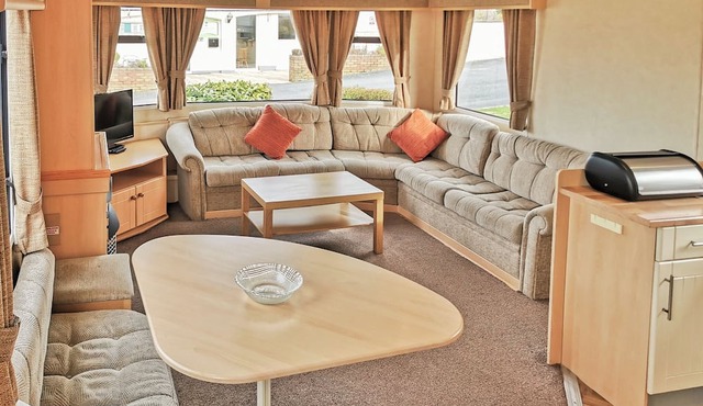 Comfortable and spacious 12ft-wide caravan with one double and two twin.