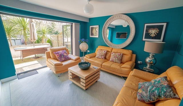 High Tide is a modern three-bedroom, boasting a luscious garden and convenient off-street parking.