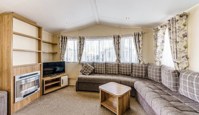 Modern and contemporary 12ft-wide caravan with one double and one twin.