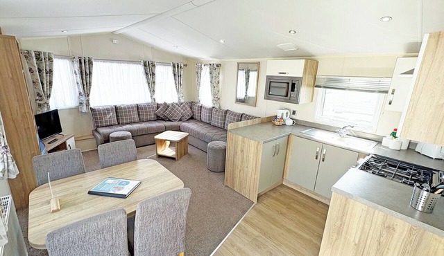 Modern and contemporary 12ft-wide caravan with one double and two twin.