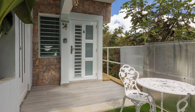 Peaceful cozy studio w a/c with breezy views, private patio & intimate space.