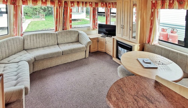 Spacious 12ft-wide caravan with one double and one twin.