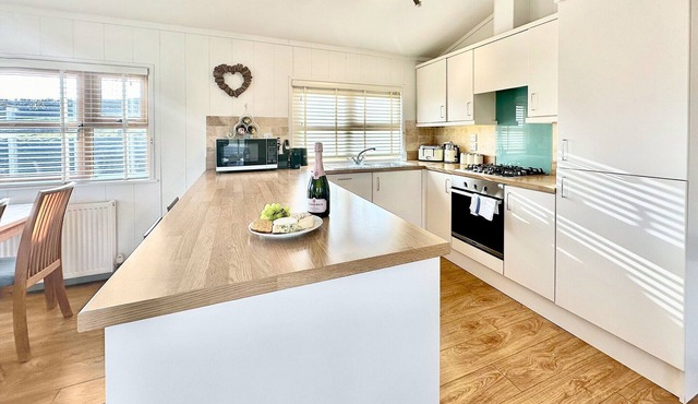 Spacious and contemporary lodge with one king size double with ensuite shower and one twin.
