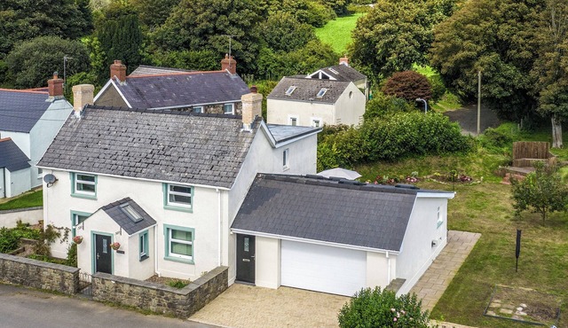 This spacious family home with glorious wood burner has all year round charm.